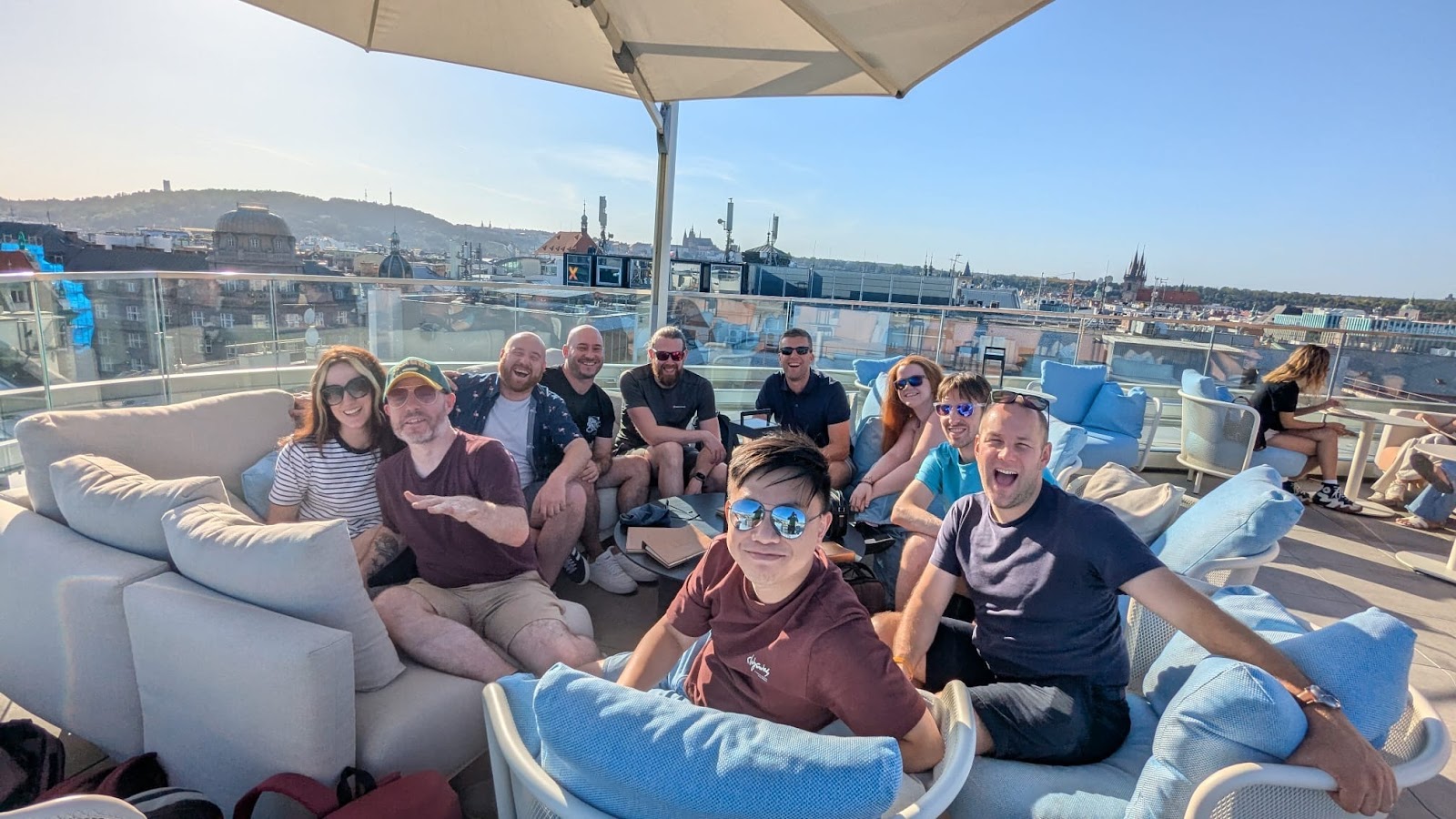 The team socialising at a rooftop bar in Prague